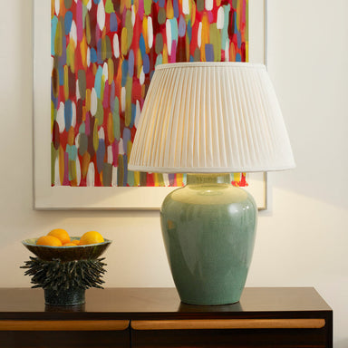 Cream Silk Knife Pleated Lampshade on Sideboard with Abstract Picture