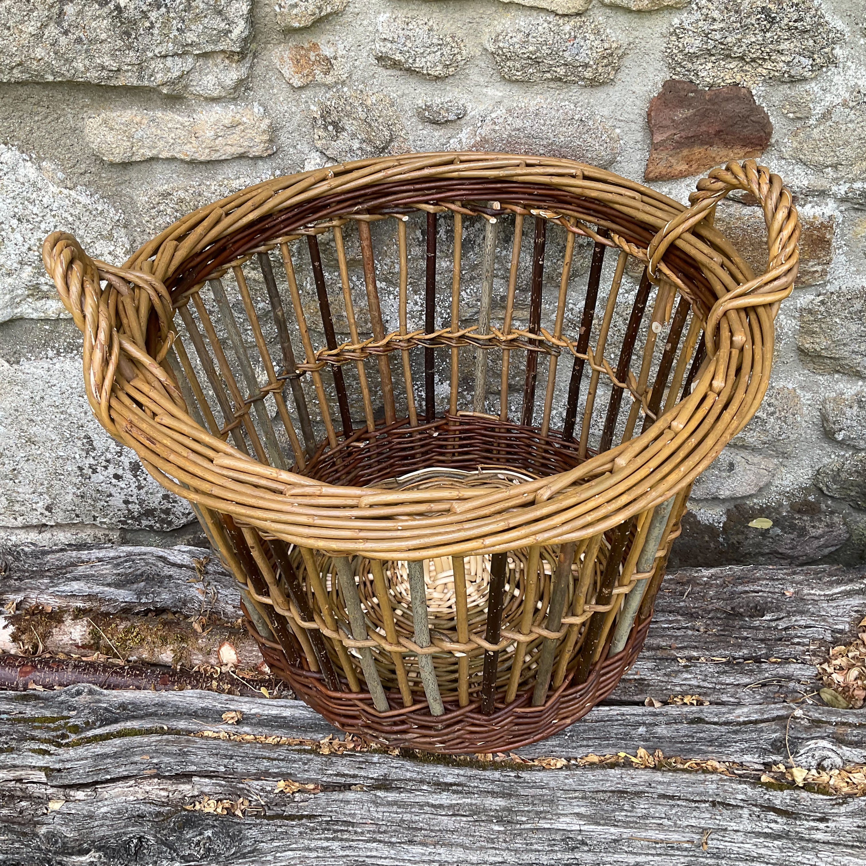 Willow can basket against a stone wall