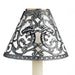 Translucent candle shade with silver filigree pattern on cream candle with white background