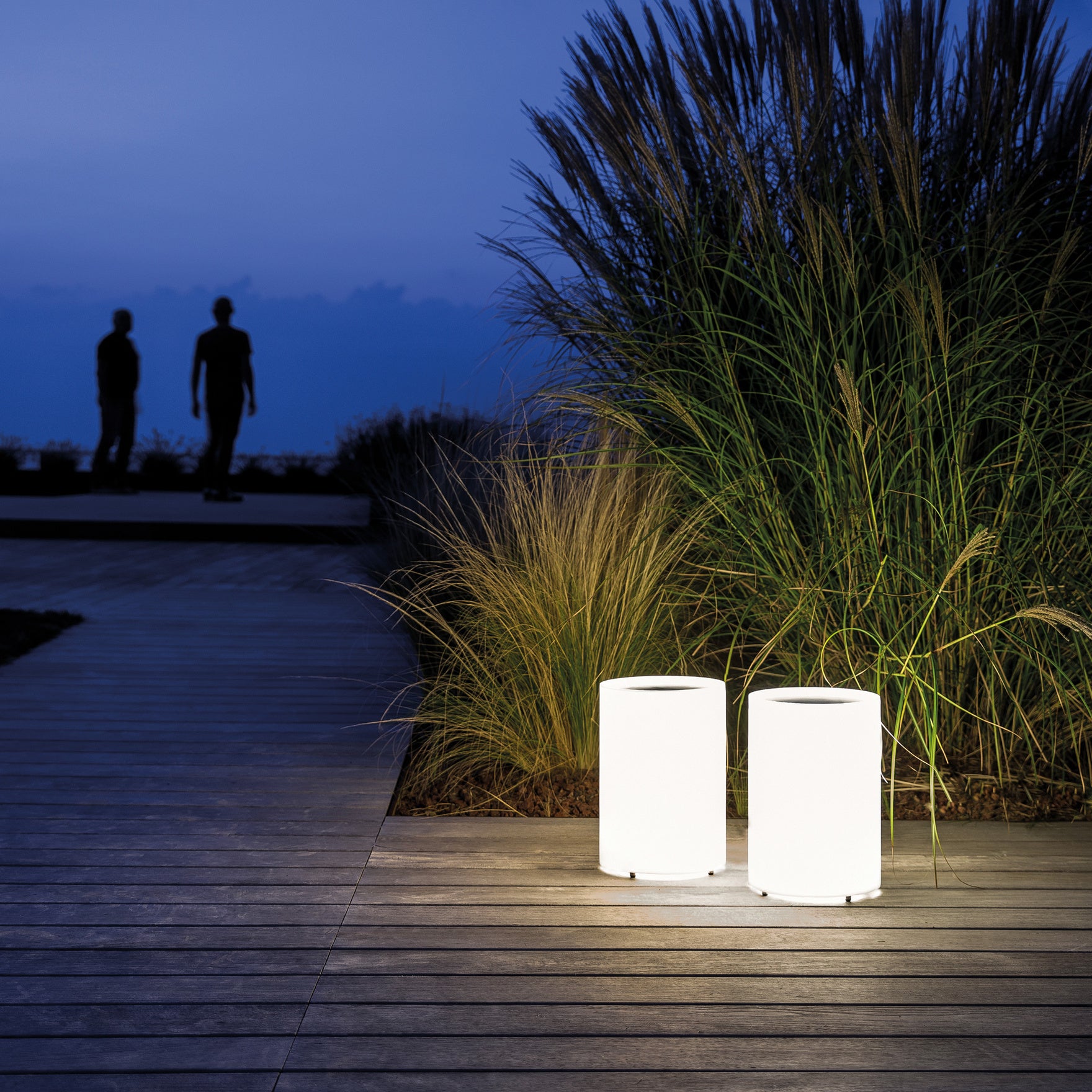 Lighting featured against timber decking and tall grasses