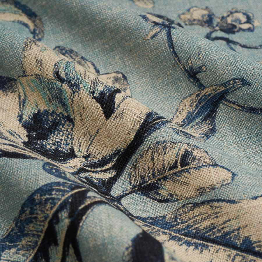 detail of printed floral design linen fabric in ink blue colour way