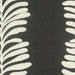 detail of embroidered fabric in charcoal and cream of leaves in stripe pattern