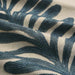 detail of embroidered fabric in jade and cream of leaves in stripe pattern