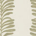 detail of embroidered fabric in pale green and cream of leaves in stripe pattern