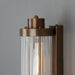 Retro Bathroom wall light fixture in Antique Brass on a grey background - detail