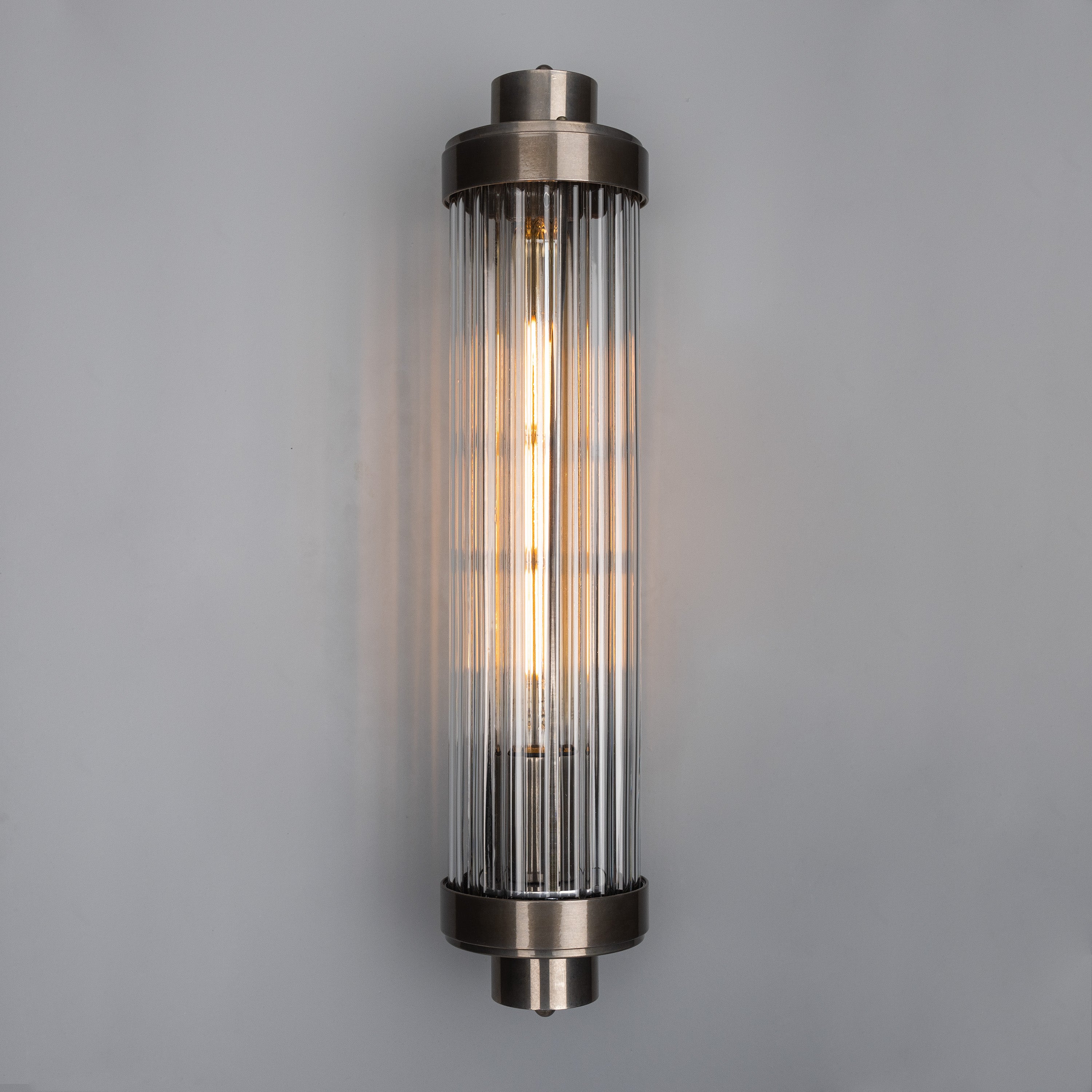 Retro Bathroom wall light fixture in Antique Silver on a grey background