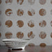 White ceramic bowl on a surface with a patterned wall in the background