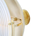 Close-up of a wall-mounted light fixture with brass accents on a white background