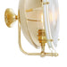 Brass wall-mounted lamp with a white glass shade on a white background