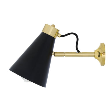 Wall-mounted lamp with black shade and brass arm on a white background