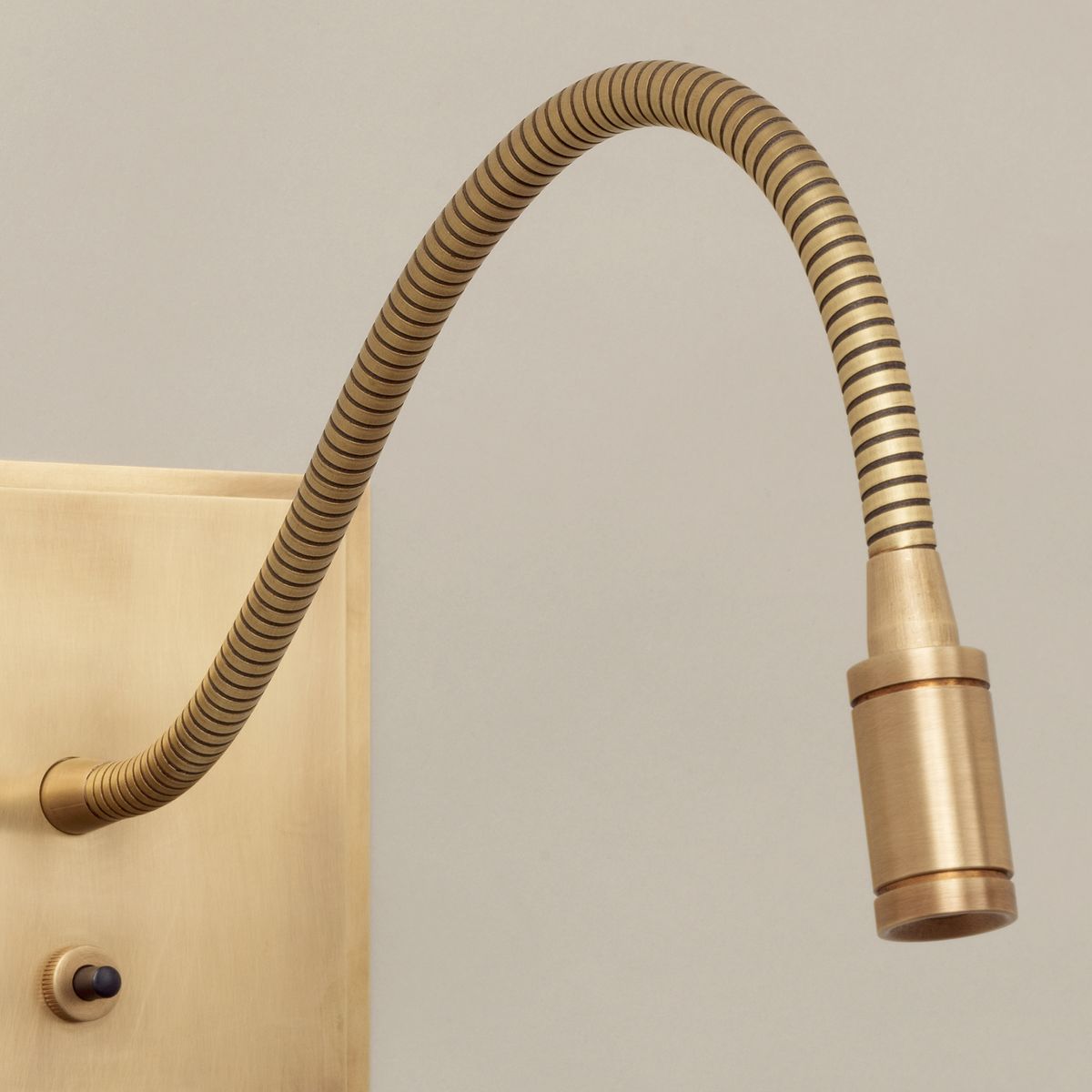 Brass LED reading wall light with goose neck arm detail