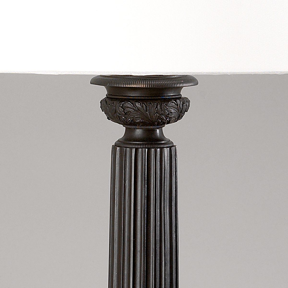 Bronze column lamp with laminated cream shade detail