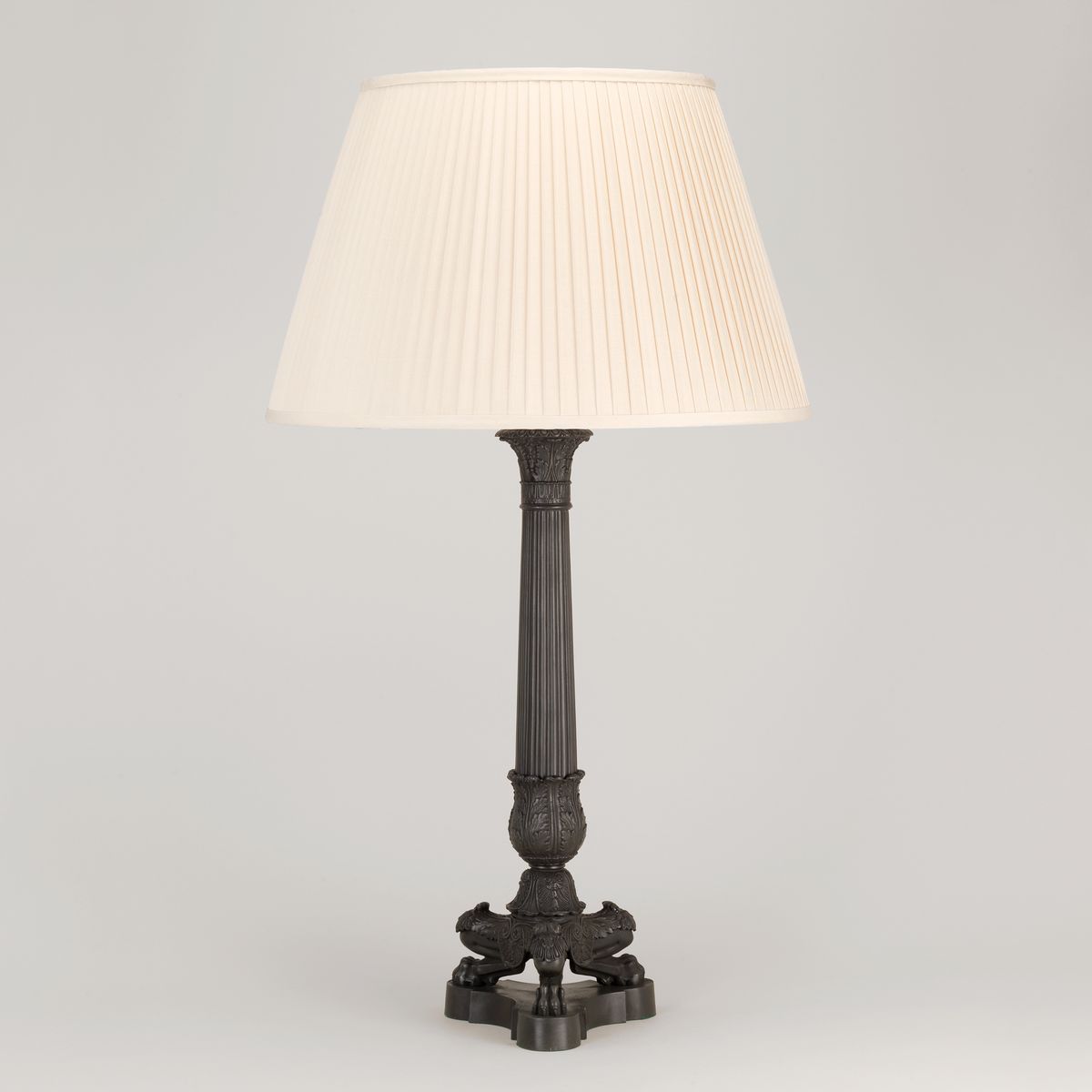 Bronze column table lamp with pleated silk cream lampshade