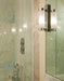 Marbled bathroom with art deco style wall light