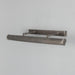 Metallic wall-mounted light fixture on a gray background