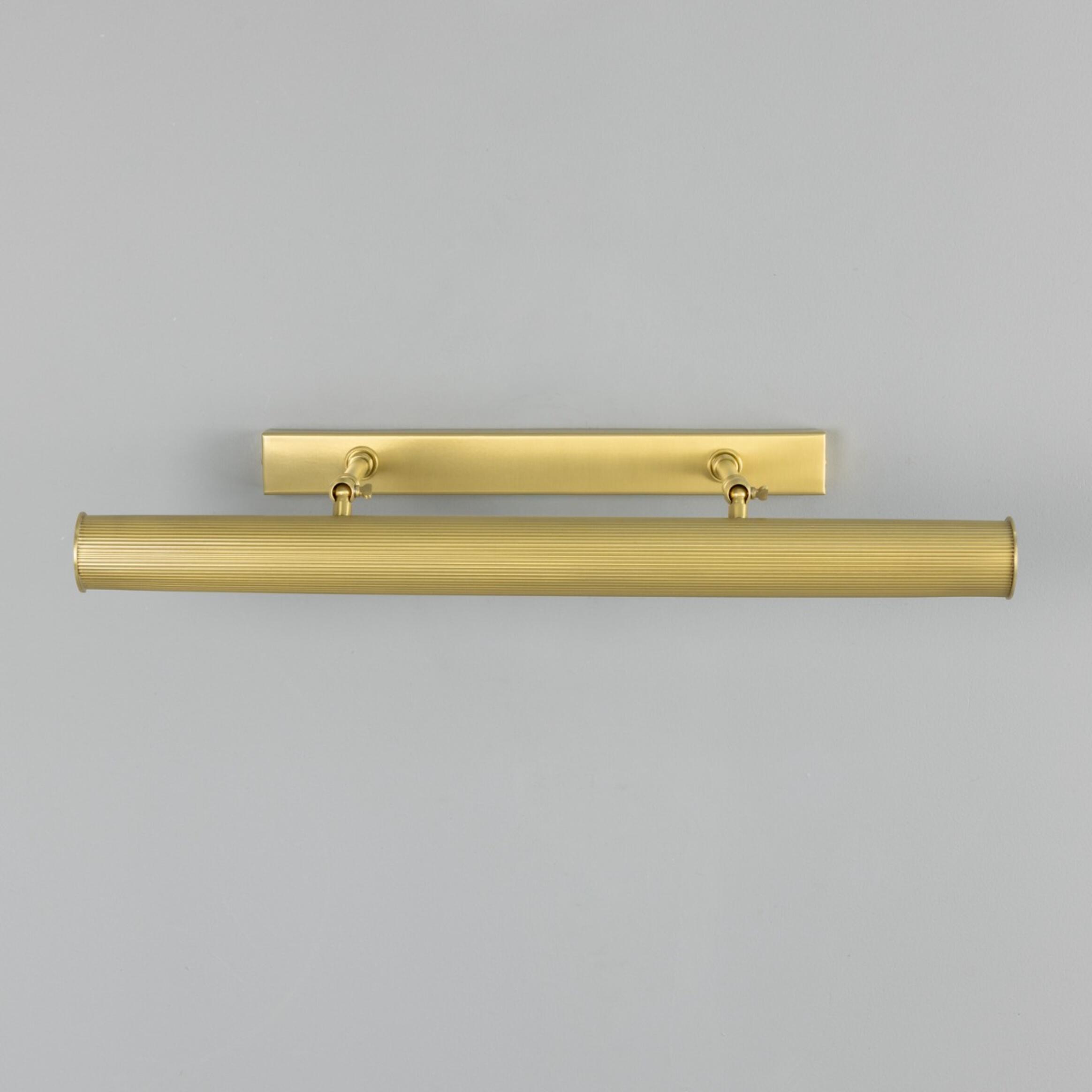 Brass metal handle on a grey background