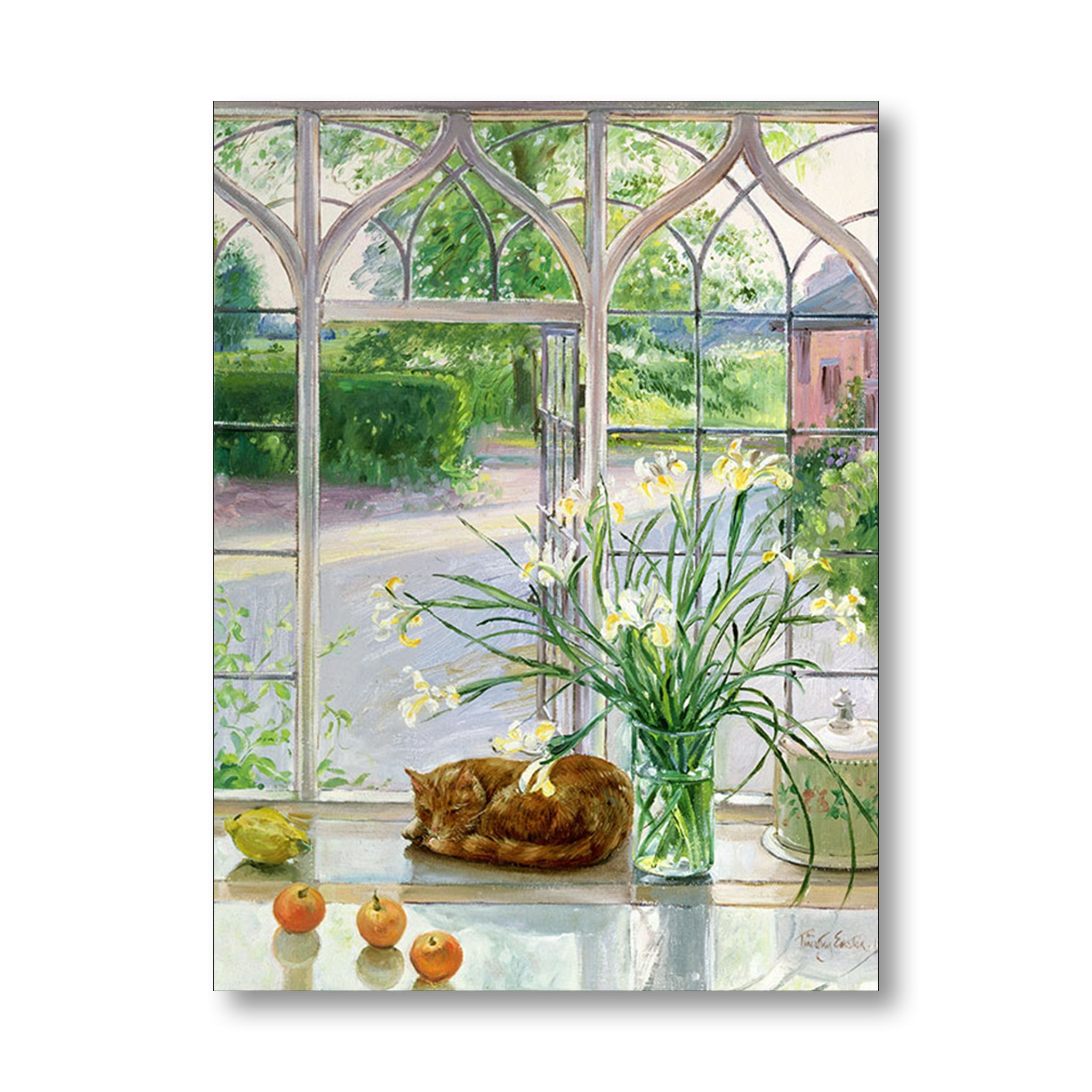 Cat resting on a windowsill with flowers and apples, looking out a large ornate window.