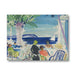 Painting of a beachside cafe with people and a sailboat.