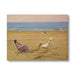Painting of people on a beach with a calm ocean and sky.