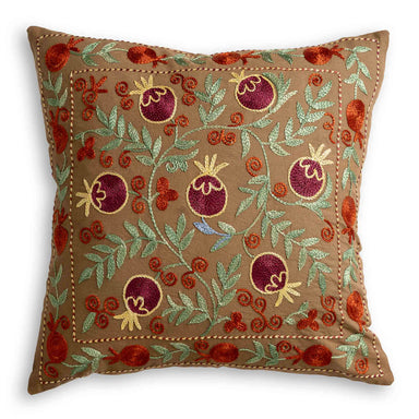 Suzani Silk Embroidered Stylised Floral Patterned Scatter Cushion on brown background with green leaves motif and burgundy coloured fruit
