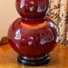 Detail of Gourd Shaped Vase Table Lamp in Sang de Boeuf Red with Black Base